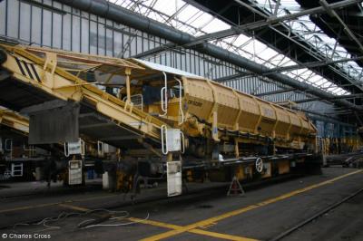 image showing a large yellow on-track machine