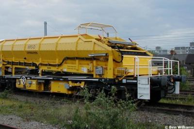 image showing a large yellow on-track machine