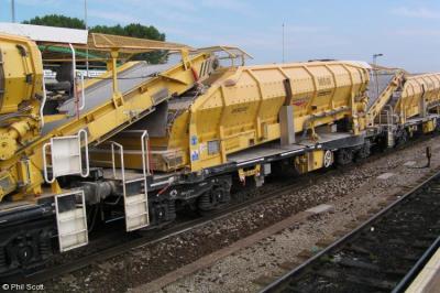 image showing a large yellow on-track machine