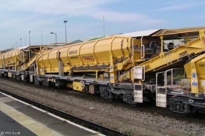image showing a large yellow on-track machine