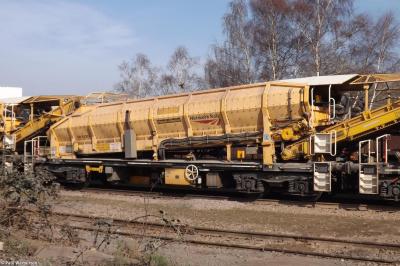 image showing a large yellow on-track machine