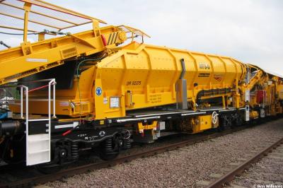 image showing a large yellow on-track machine