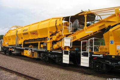 image showing a large yellow on-track machine