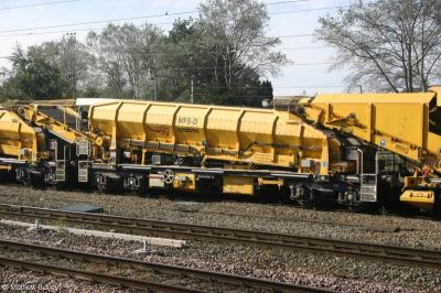 image showing a large yellow on-track machine
