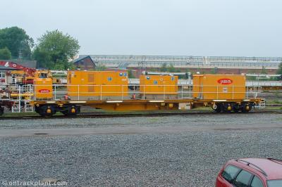image showing a large yellow on-track machine