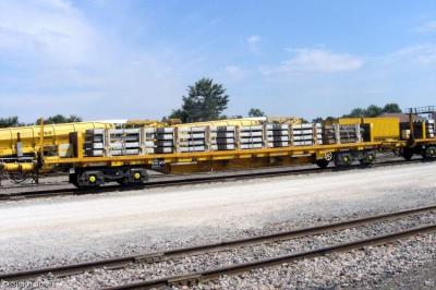 image showing a large yellow on-track machine