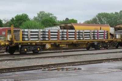 image showing a large yellow on-track machine