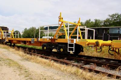 image showing a large yellow on-track machine