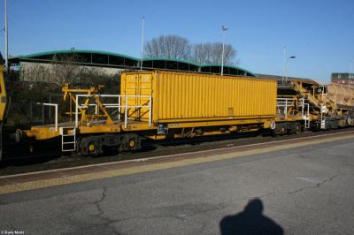image showing a large yellow on-track machine