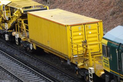 image showing a large yellow on-track machine