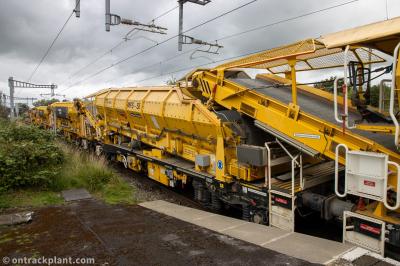 image showing a large yellow on-track machine