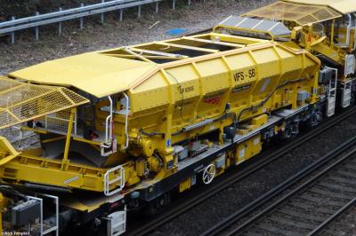 image showing a large yellow on-track machine