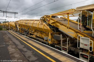 image showing a large yellow on-track machine