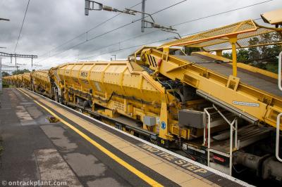 image showing a large yellow on-track machine