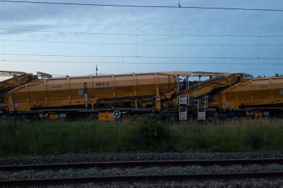 image showing a large yellow on-track machine