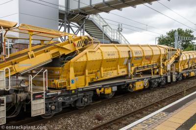 image showing a large yellow on-track machine