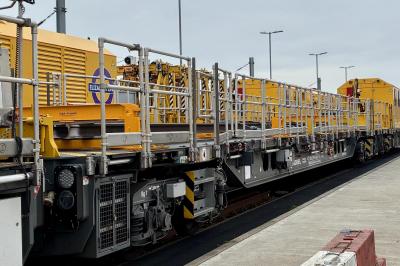 image showing a large yellow on-track machine