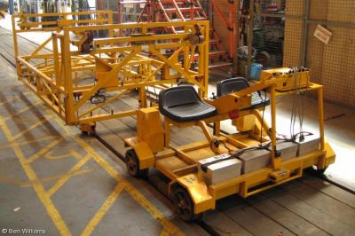 image showing a large yellow on-track machine