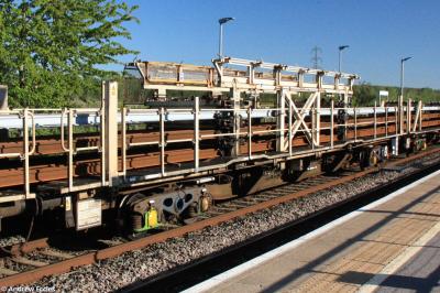 image showing a large yellow on-track machine