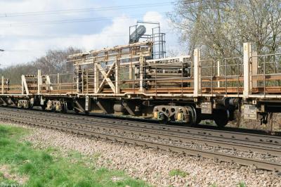 image showing a large yellow on-track machine