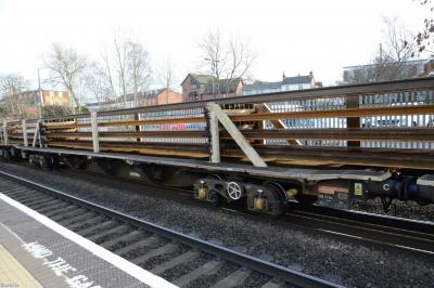 image showing a large yellow on-track machine