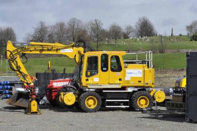 image showing a large yellow on-track machine