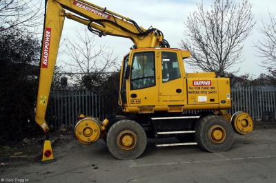 image showing a large yellow on-track machine