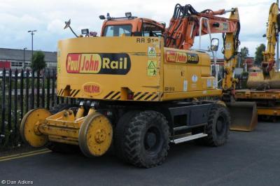 image showing a large yellow on-track machine
