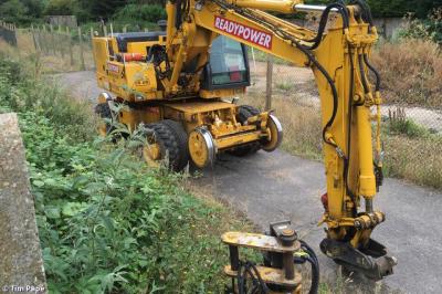 image showing a large yellow on-track machine