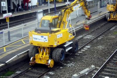 image showing a large yellow on-track machine
