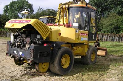image showing a large yellow on-track machine