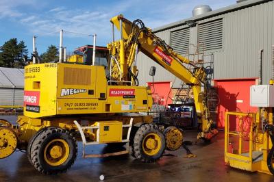 image showing a large yellow on-track machine