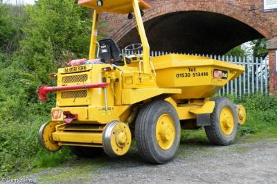 image showing a large yellow on-track machine