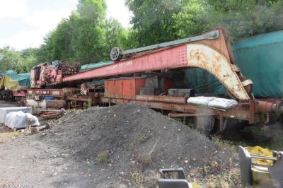 image showing a large yellow on-track machine