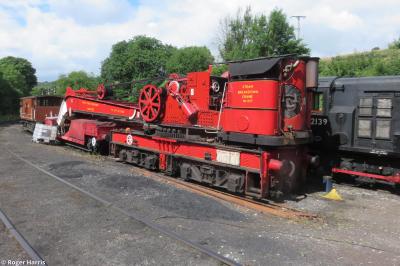 image showing a large yellow on-track machine