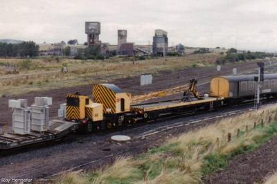 image showing a large yellow on-track machine