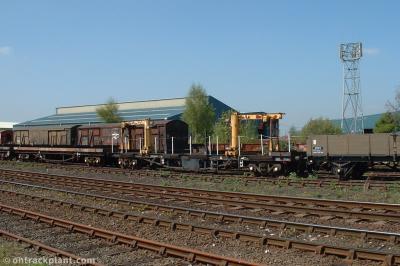 image showing a large yellow on-track machine