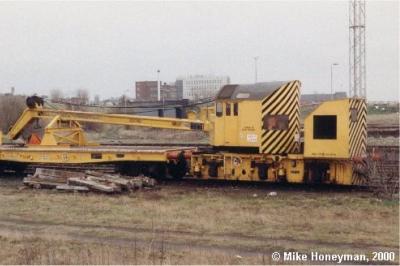 image showing a large yellow on-track machine