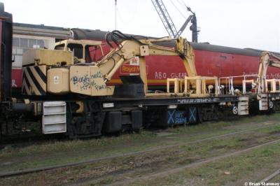 image showing a large yellow on-track machine