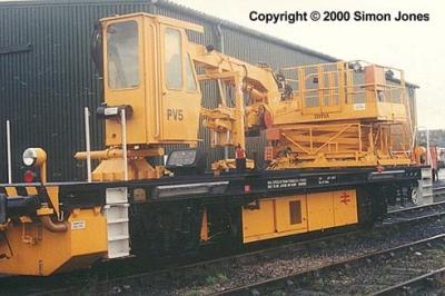 image showing a large yellow on-track machine
