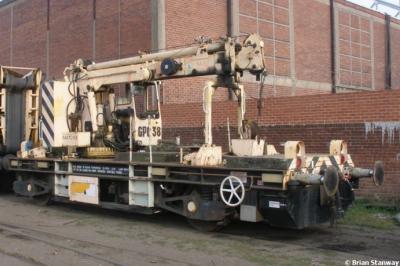 image showing a large yellow on-track machine
