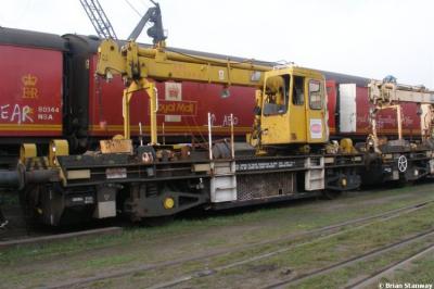 image showing a large yellow on-track machine