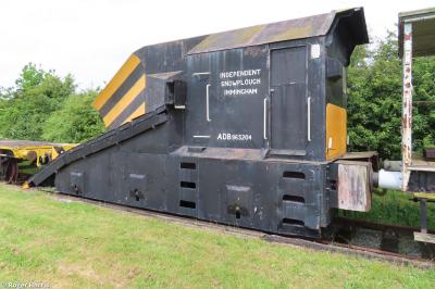 image showing a large yellow on-track machine