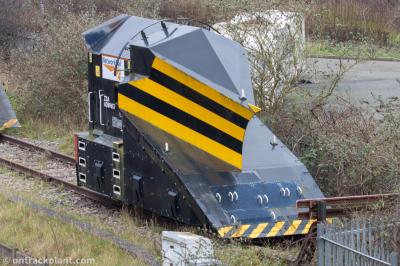 image showing a large yellow on-track machine