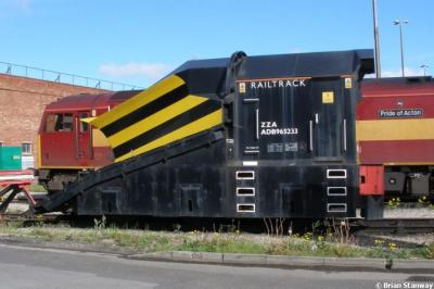 image showing a large yellow on-track machine