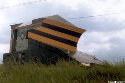 image showing a large yellow on-track machine