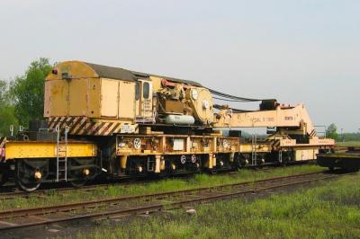 image showing a large yellow on-track machine