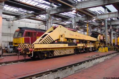 image showing a large yellow on-track machine