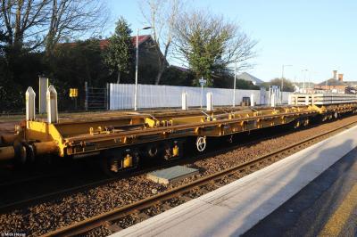 image showing a large yellow on-track machine
