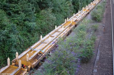 image showing a large yellow on-track machine